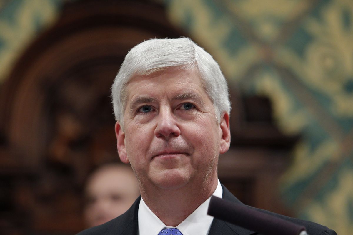 FILE - In this Jan. 23, 2018, file photo Michigan Gov. Rick Snyder delivers his State of the State address to a joint session of the House and Senate at the state Capitol in Lansing, Mich. Former Michigan governor Snyder backed Joe Biden for president on Thursday, Sept. 3, 2020, becoming the latest high-profile Republican to support the Democratic nominee over President Donald Trump.  (Al Goldis)