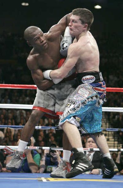 
Ricky Hatton, right, grabs Floyd Mayweather Jr. during Saturday's WBC title bout. Associated Press
 (Associated Press / The Spokesman-Review)