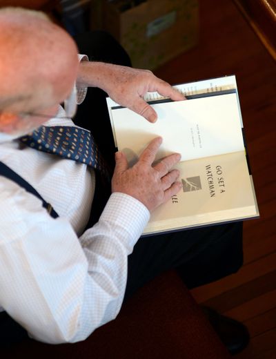 Mike Sullivan, of Tuscaloosa, Ala., opens his copy of “Go Set A Watchman” on the morning of the book’s release in the hometown of “To Kill a Mockingbird” author Harper Lee, in Monroeville, Ala.. (Associated Press)