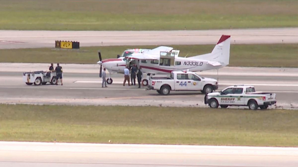 Emergency personnel surround a Cessna plane at Palm Beach International Airport Tuesday in West Palm Beach, Fla.  (WPTV)