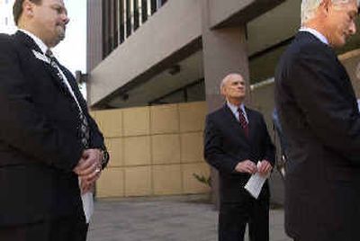 Spokane business leaders, from left, Harry Sladich, Rich Hadley, and Anthony Bonanzino, call for Mayor Jim West's resignation during a news conference Monday.
(The Spokesman-Review)