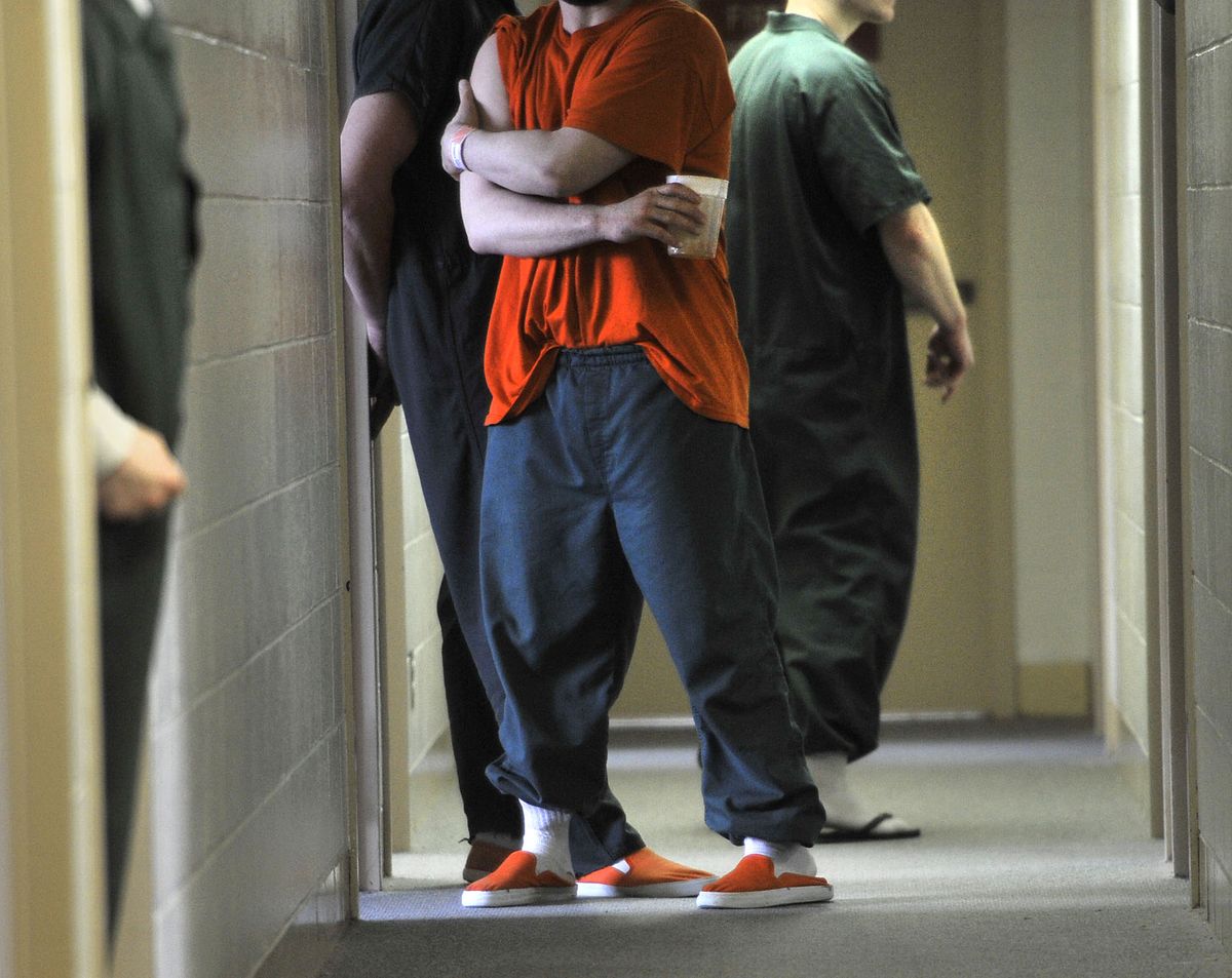 Offenders take to the narrow hallways of B building at Geiger Corrections Center on Tuesday. (Dan Pelle)