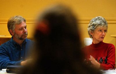 
Group leaders Randy Rinauro, left, and Sandee Overstreet listen as one of the participants talks about the trials of being a recently divorced person and how society perceives their new singleness, during a DivorceCare meeting at Mirabeau Chapel. 
 (Liz Kishimoto / The Spokesman-Review)