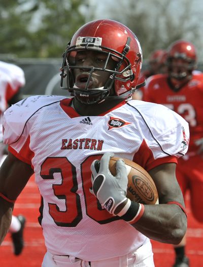 Eastern Washington University's Darriell Beaumonte breaks away from the crowd as he runs for a 63-yard TD in the 2nd quarter during the Eagles' 2011 Red-White Spring football game at Roos Field in Cheney, Wash. (Dan Pelle / The Spokesman-Review)