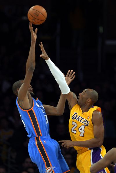 OKC’s Kevin Durant shoots over Kobe Bryant of the Lakers. (Associated Press)