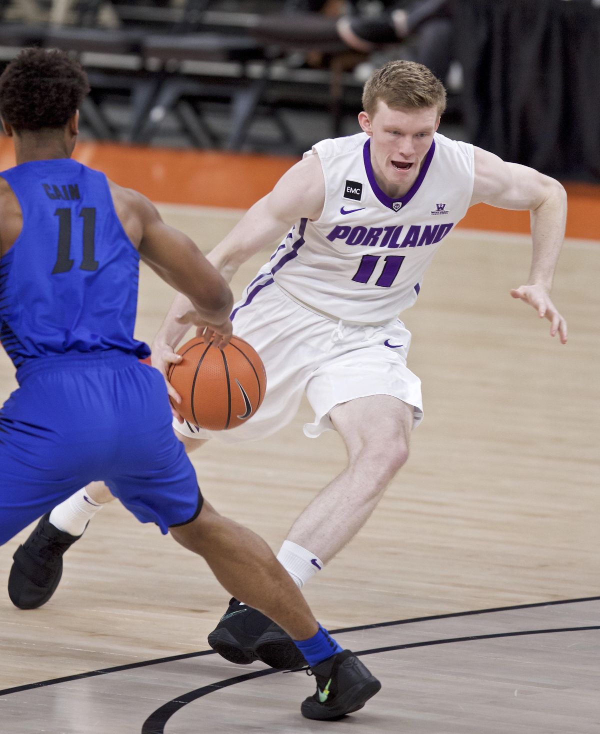 Portland guard Josh McSwiggan, right, dribbles past DePaul guard Eli Cain during the first half of an NCAA college basketball game in the Phil Knight Invitational tournament in Portland, Ore., Sunday, Nov. 26, 2017. (Craig Mitchelldyer / Associated Press)
