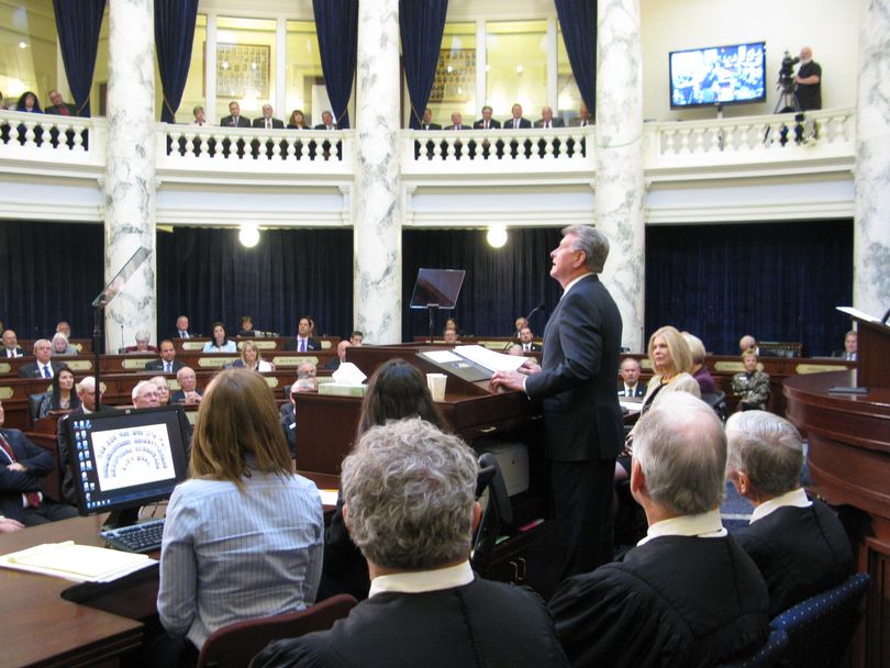 Gov. Butch Otter acknowledges his family as he opens his State of the State address on Monday (Betsy Z. Russell)