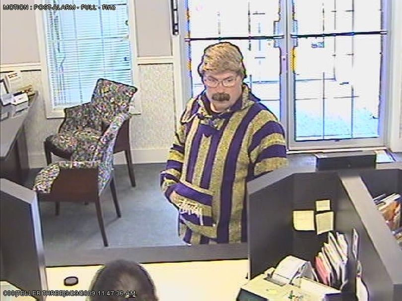 The FBI is looking for this man, who robbed the INB bank branch at Hawthorne Road and Nevada Street at gunpoint Tuesday, Sept. 29, 2009. Officials say the suspect tied up bank employees with duct tape during the robbery. (Spokane Valley Police Department)