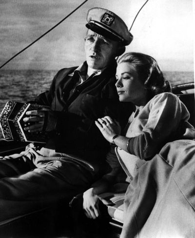 Bing Crosby shares a scene with Grace Kelly in 1956’s “High Society.” At top: Crosby in “White Christmas.” (Associated Press)