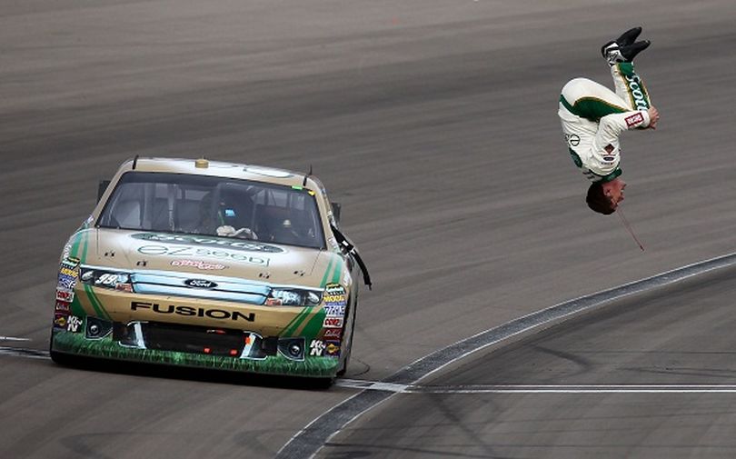 Carl Edwards does his trademark backflip after winning for the second time at Las Vegas Motor Speedway. (Photo Credit: Jonathan Ferrey/Getty Images) (Jonathan Ferrey / Getty Images North America)