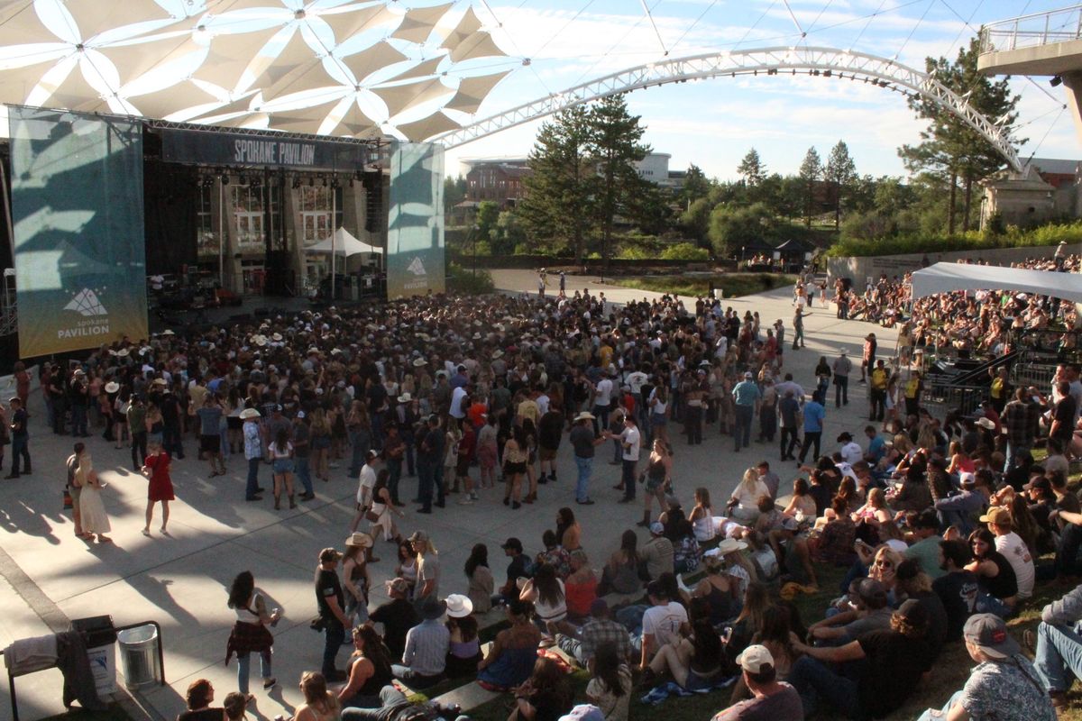 Concert-goers await Zach Bryan on the concrete and grass of the Riverfront Pavilion in this July 2022 photo.  (Jordan Tolley-Turner/For The Spokesman-Review)
