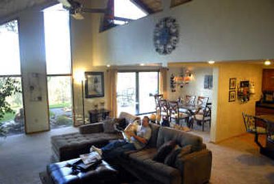 
Bruce Curran relaxes in his southeast Spokane home, which he and his wife recently remodeled. While home prices in Spokane have remained surprisingly strong, an increasing number of properties are being listed below appraised values. Curran has been in his home for three years and is looking to downsize. 
 (Jed Conklin / The Spokesman-Review)