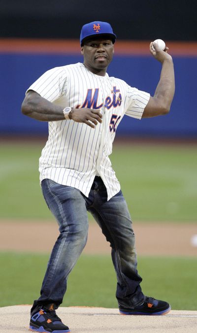 50 Cent throws out the ceremonial first pitch – poorly – before Tuesday’s game between the New York Mets and the Pittsburgh Pirates. (Associated Press)