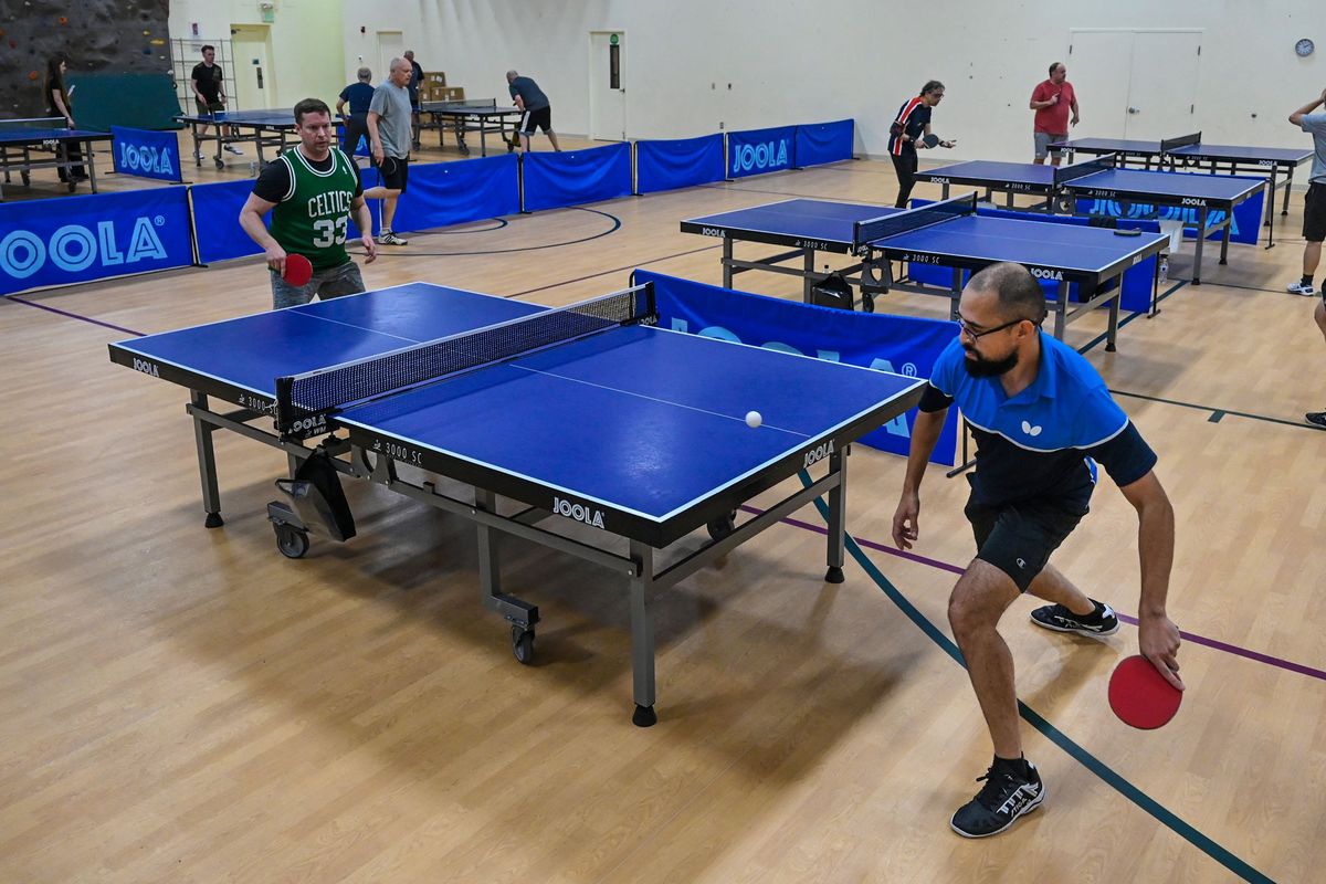 West Central Table Tennis director Nick Dotson, left, waits for a return shot from Luis Ponton during play at the Girls Scouts Building, Sunday, March 17, 2024, in Spokane.  (DAN PELLE/THE SPOKESMAN-REVIEW)