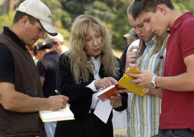 
Professor Diane Wolfgra explains how to properly log measurements to students, from left, Ben Sorensen, Hannah Clark and Nick Kunstek during an outdoor lab at Montana Tech. Associated Press
 (Associated Press / The Spokesman-Review)