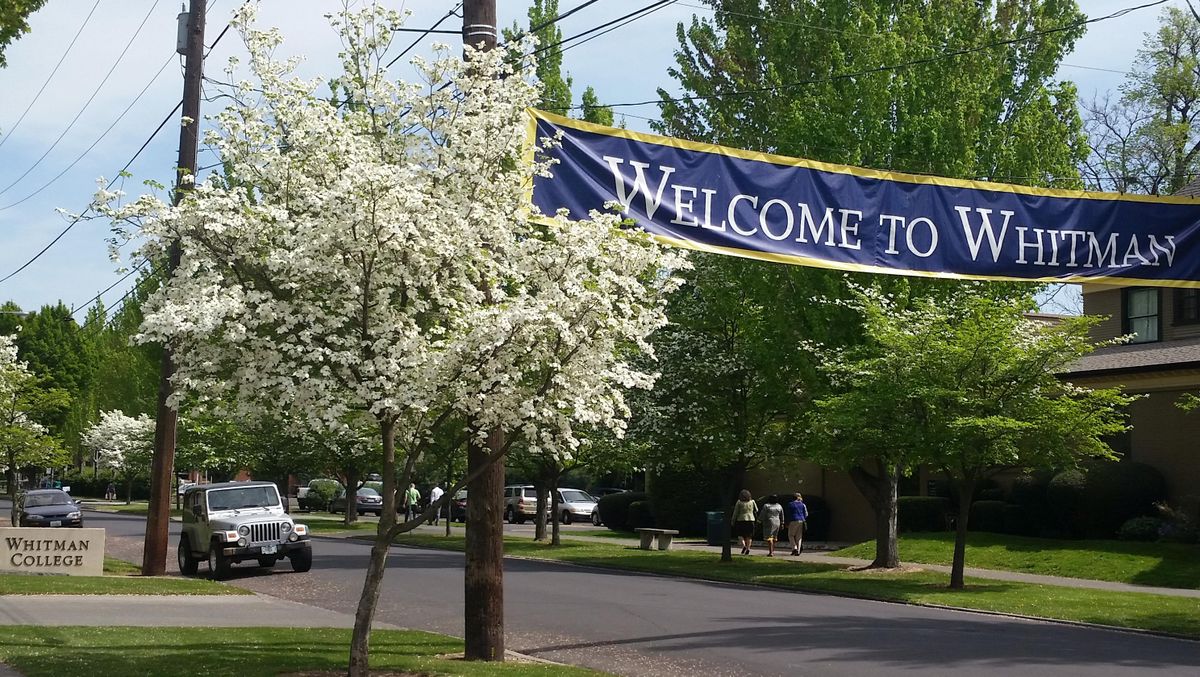 In this photo taken Thursday, April 21, 2016, signs designate the entrance to the Whitman College campus in Walla Walla. (Tom Skeen / Walla Walla Union-Bulletin via AP)