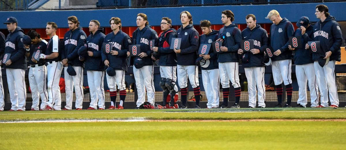 Gonzaga baseball players hold#8 in the eighth inning in honor of associate head coad Danny Evans, who passed away on April 23, during at game against Santa Clara on Friday, May 13, 2022.  (kathy plonka)