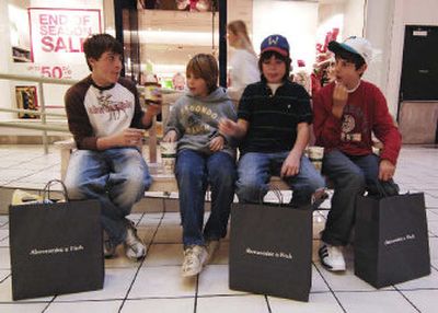 
Young shoppers stop for a snack after redeeming gift cards at a store on Monday at the Crystal Mall in Waterford, Conn. 
 (Associated Press / The Spokesman-Review)
