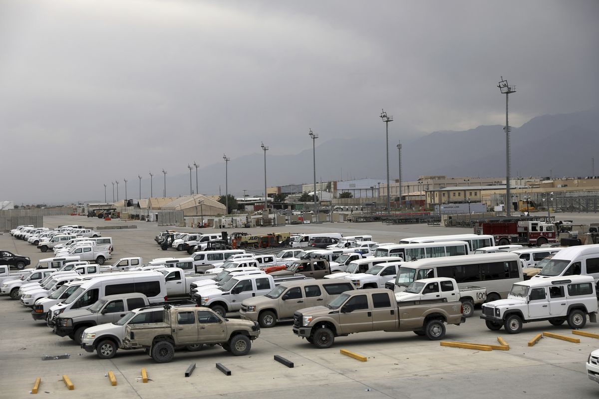 FILE - In this July 5, 2021 file photo, vehicles are parked at Bagram Airfield after the American military left the base, in Parwan province north of Kabul, Afghanistan. The US and NATO have promised to pay $4 billion a year until 2024 to finance Afghanistan’s military and security forces, which are struggling to contain an advancing Taliban. Already since 2001, the U.S. has spent nearly $89 billion to build, equip and train the forces, including nearly $10 billion for vehicles and aircraft.  (Rahmat Gul)