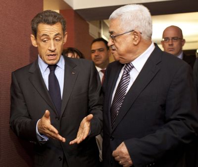 French President Nicolas Sarkozy, left, meets with Palestinian President Mahmoud Abbas during the 66th session of the U.N. General Assembly on Tuesday. (Associated Press)