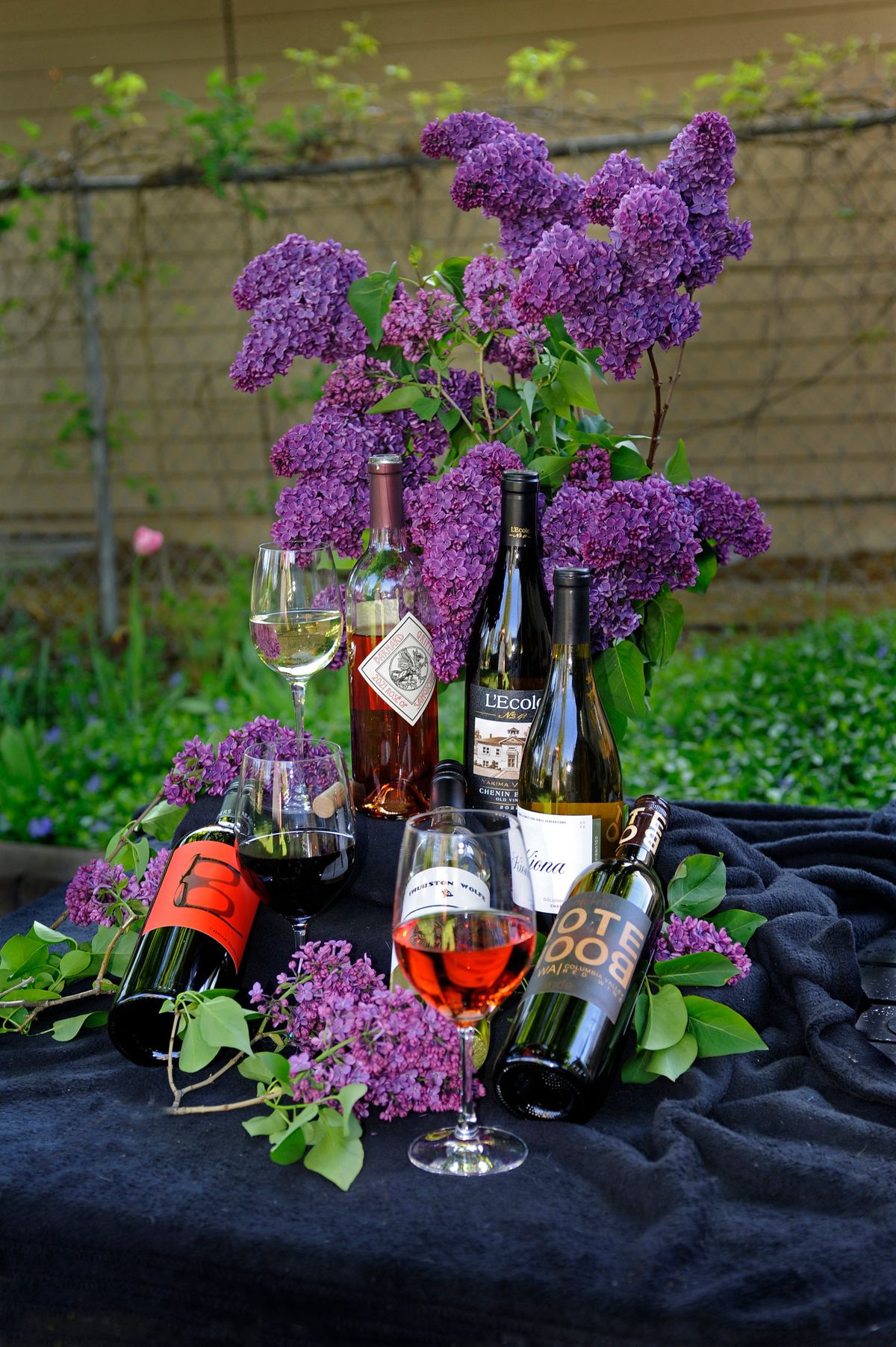 You may have to search a little but these wines are outstanding quality and price point. Top to bottom are Barnard Griffin Rose of Sangiovese, which is also in the glass in the front showing off the stunning color, and the Chenin Blanc of L’Ecole and Kiona. From bottom left to right are a Bookwalter Cab, the Thurston Wolfe PGV and the Bookwalter Notebook Red Blend.  (Christopher Anderson/For The Spokesman Review)