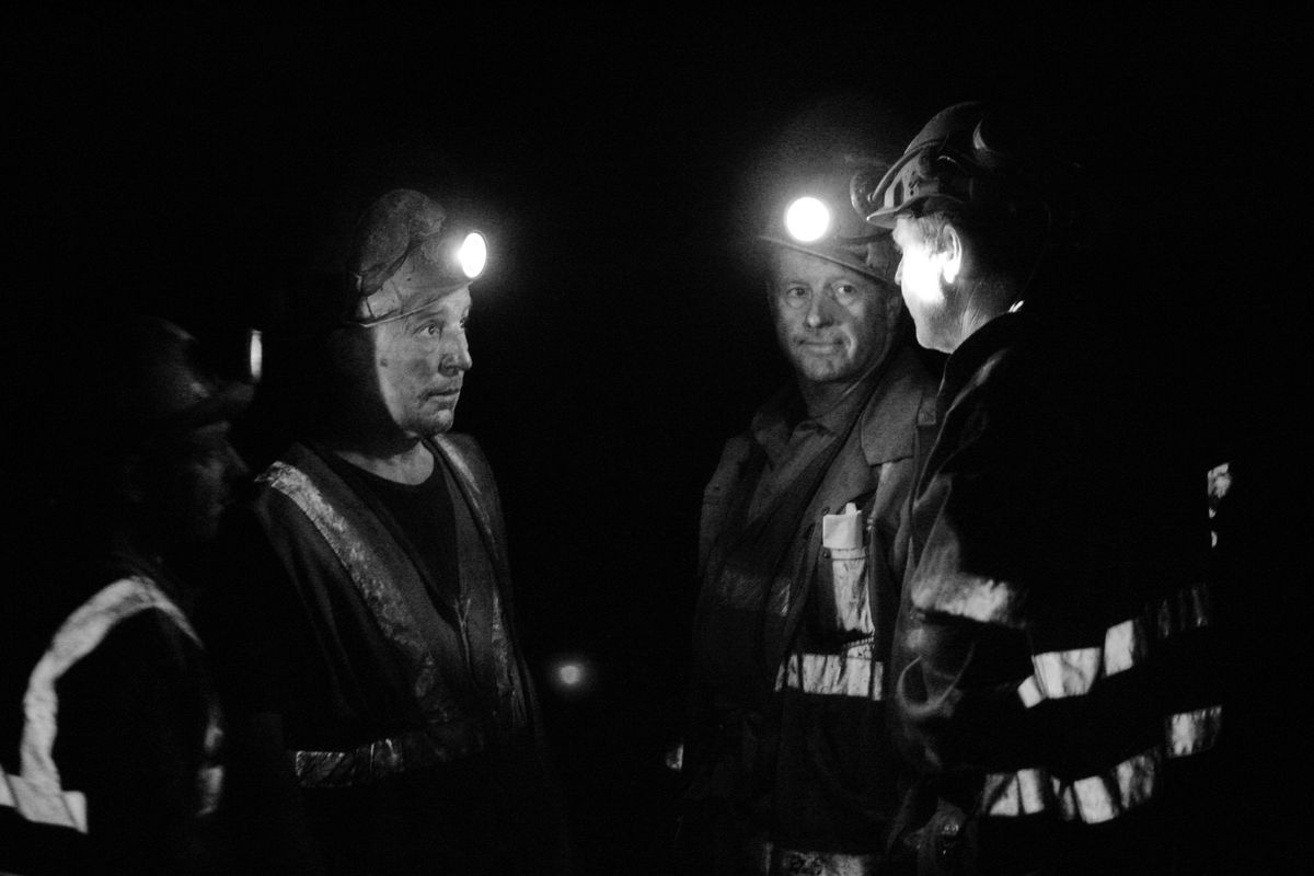 Miners discuss their shift  while working underground  at the Unity mine in August. (Lefteris Pitarakis / The Spokesman-Review)