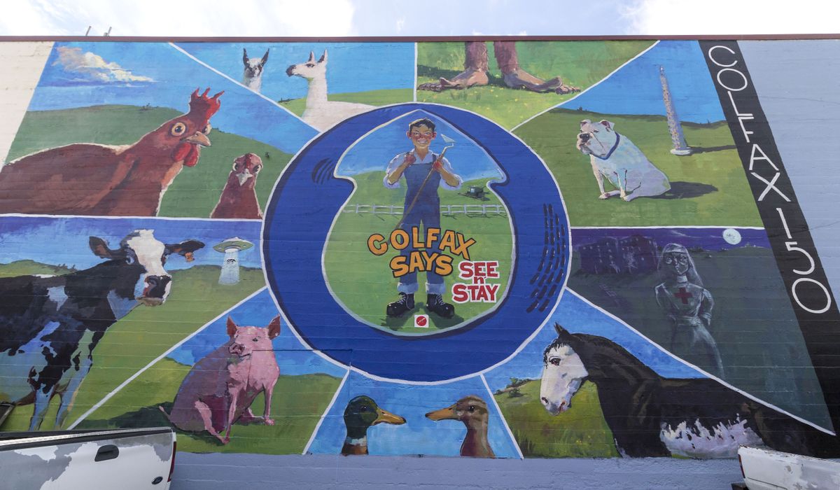 Artist Henry Stinson painted this mural on the end of the Whitman County Public Services Building in Colfax to honor the town’s 150th year.  (Geoff Crimmins/For The Spokesman-Review)