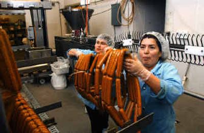 
Workers prepare sausage links for cooking at Turtle Island Foods in Hood River, Ore.
 (Associated Press / The Spokesman-Review)