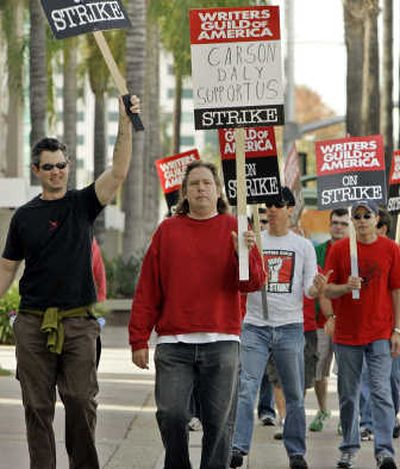 
Film and television writers picket outside NBC Studios Thursday in Burbank, Calif. The picketers were protesting Carson Daly's 