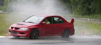 Priced from just under $30,000, the Evo runs the 0-60 sprint in 4.4 seconds and the quarter-mile in 13-and-change. In the MR trim we tested, it will hit 150 mph and with its standard-issue Yokahamas, it manages 0.98 lateral G's on the skidpad.
(The Spokesman-Review)