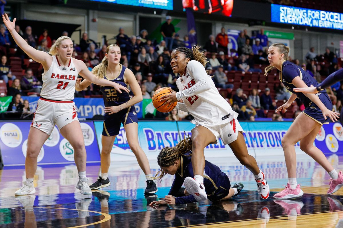 Eastern Washington guard Aaliyah Alexander (25) drives to the basket after Montana State guard Malea Egan (1) falls down defending during semifinals in the Big Sky Women’s Basketball tournament, Tuesday, March 12, 2024, in Boise, Idaho. Eastern Washington advanced to the Championship game with a 56-39 victory.  (Steve Conner/For The Spokesman-Review)
