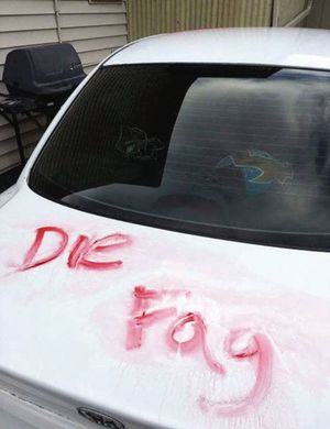 WSU student John Kraus found these hate words sprayed in red n his white Kia recently (Courtesy: Moscow-Pullman Daily News)
