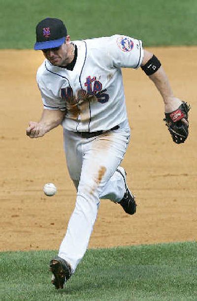 
Mets' third baseman David Wright bobbles a ground ball.
 (Associated Press / The Spokesman-Review)