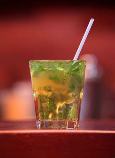 A Mojito, left, and a frozen cocktail called Kokroko, right, are made with the Ghanian spirit akpeteshie.