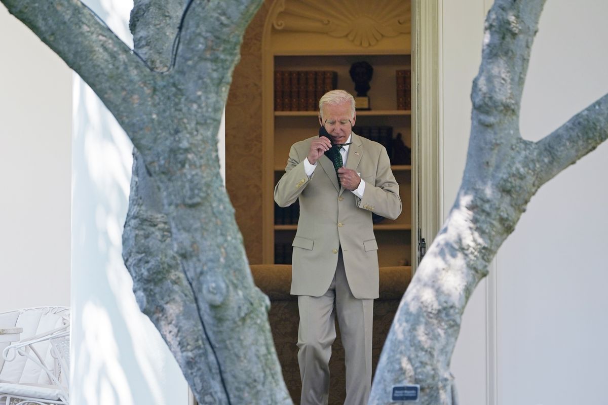 In this Aug. 6, 2021, photo, President Joe Biden walks out of the Oval Office and heads to Marine One on the South Lawn of the White House in Washington, as he heads to Wilmington, Del., for the weekend. Biden should be heading out on vacation and a traditional August break from Washington. But with the Senate still in session and working on his bipartisan infrastructure bill for the second straight weekend, and likely into next week, Biden hasn’t gone far.  (Susan Walsh)