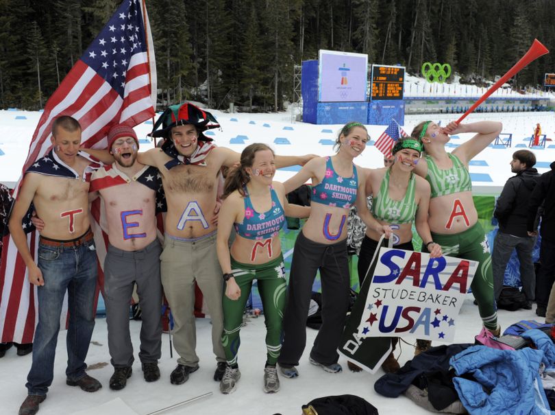 Supporters of United States's biathlete Sara Studebaker celebrate during the  women's 4x6 km biathlon relay at the Vancouver 2010 Olympics in Whistler, British Columbia, Tuesday, Feb. 23, 2010. (Jens Meyer / Associated Press)