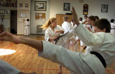 
Members of the leadership team practice at the Family Karate Center in preparation for their performance at Riverfront Park for Kids Day on Saturday. 
 (Jed Conklin / The Spokesman-Review)