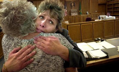 
Shannon Sullivan celebrates a judge's decision Monday that she may begin collecting signatures on her petition to recall Spokane Mayor Jim West. 
 (Brian Plonka photos/ / The Spokesman-Review)