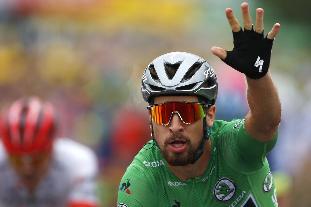 Slovakia’s Peter Sagan, wearing the best sprinter’s green jersey, crosses the finish line to win the thirteenth stage of the Tour de France cycling race over 169.5 kilometers (105.3 miles) with start in Bourg d’Oisans and finish in Valence, France, Friday July 20, 2018. (Peter Dejong / Associated Press)