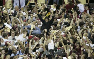 Florida State fans storm the court following the Seminoles' 70-66 upset win over Florida.
(Associated Press / The Spokesman-Review)