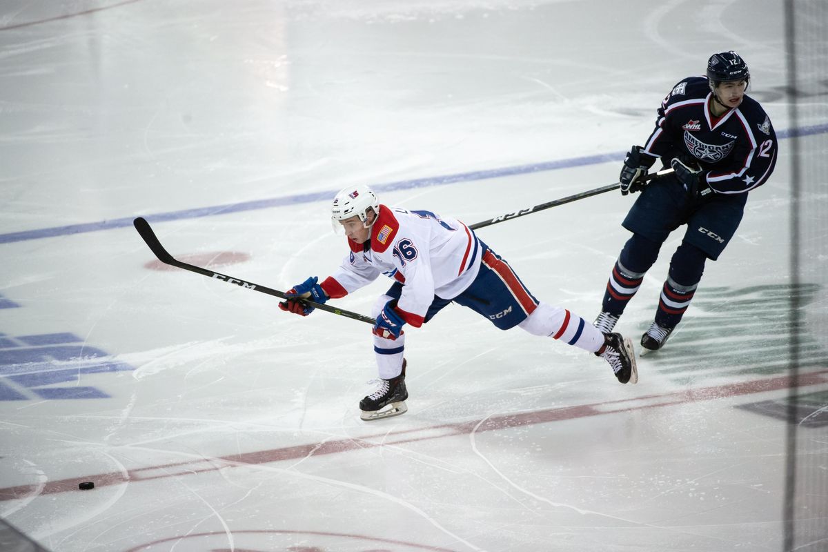 Cordel Larson (16) of the Spokane Chiefs chases after a loose puck during a game against the Tri City Americans on Jan. 12, 2019 at the Spokane Arena. (Libby Kamrowski / The Spokesman-Review)