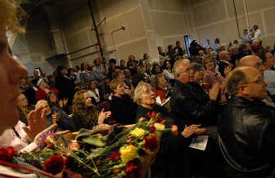 
A standing-room-only crowd applauds the community members who contributed to the Salvation Army Family Resource Center on Wednesday in Spokane. The new facility provides additional family emergency shelter, family services and a food bank. 
 (Jed Conklin / The Spokesman-Review)