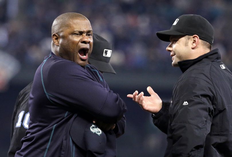Mariners manager Lloyd McClendon, left, expresses himself to umpire Will Little. (Associated Press)