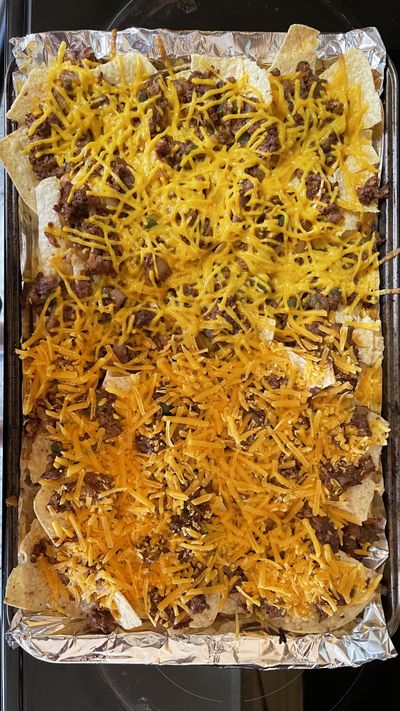 Nachos made with vegan cheese from Daiya, top, and Violife.  (Jonathan Glover/The Spokesman-Review)