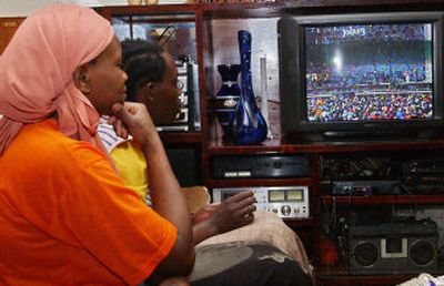 
A Kenyan family watches a Live 8 concert broadcast from Johannesburg at their home in Nairobi on Saturday. The concert was being broadcast across Africa, but on a continent where many don't have electricity – let alone a television set and satellite dish – few were  able to see it.
 (Associated Press / The Spokesman-Review)