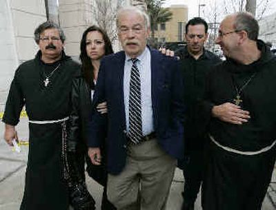 
Terri Schiavo's father, Bob Schindler, center, leaves Monday's  court hearing in Tampa, Fla. 
 (Associated Press / The Spokesman-Review)