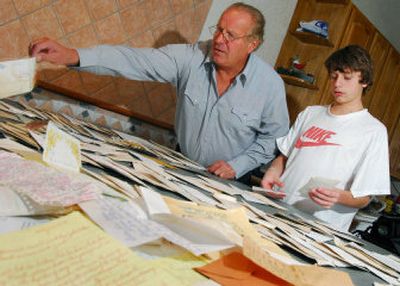 
Bill Lacovara, with his son, Rocky, 16, are shown in their home in Ventnor, N.J., on Monday, as they sort through letters they found while fishing near a pier in Atlantic City, N.J. 
 (Associated Press / The Spokesman-Review)