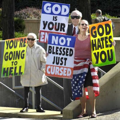 
Margie M. Phelps, left, demonstrates with her husband, Fred Phelps, and her daughter Margie J. Phelps  on Wednesday outside the federal courthouse in Baltimore. Associated Press
 (Associated Press / The Spokesman-Review)