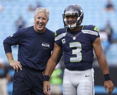 Seahawks coach Pete Carroll and quarterback Russell Wilson destroyed 49ers 42-13 in December. (Associated Press)