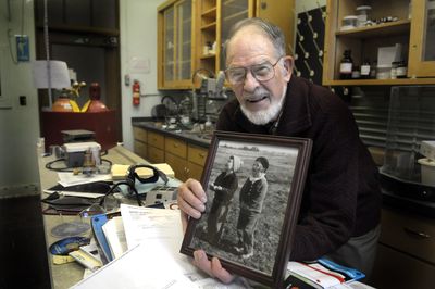 Don Matteson holds a 1937 photo of himself and the girl who became his wife, Marianna, in his lab at WSU’s Fulmer Hall.  (CHRISTOPHER ANDERSON / The Spokesman-Review)